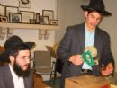 Rabbinical student Mordy Rudolph and brother Izzy pack food for inmates - Passover 2003